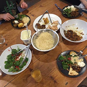 Moroccan meatballs, tagine of caramelised onions and eggplant with roasted cauliflower